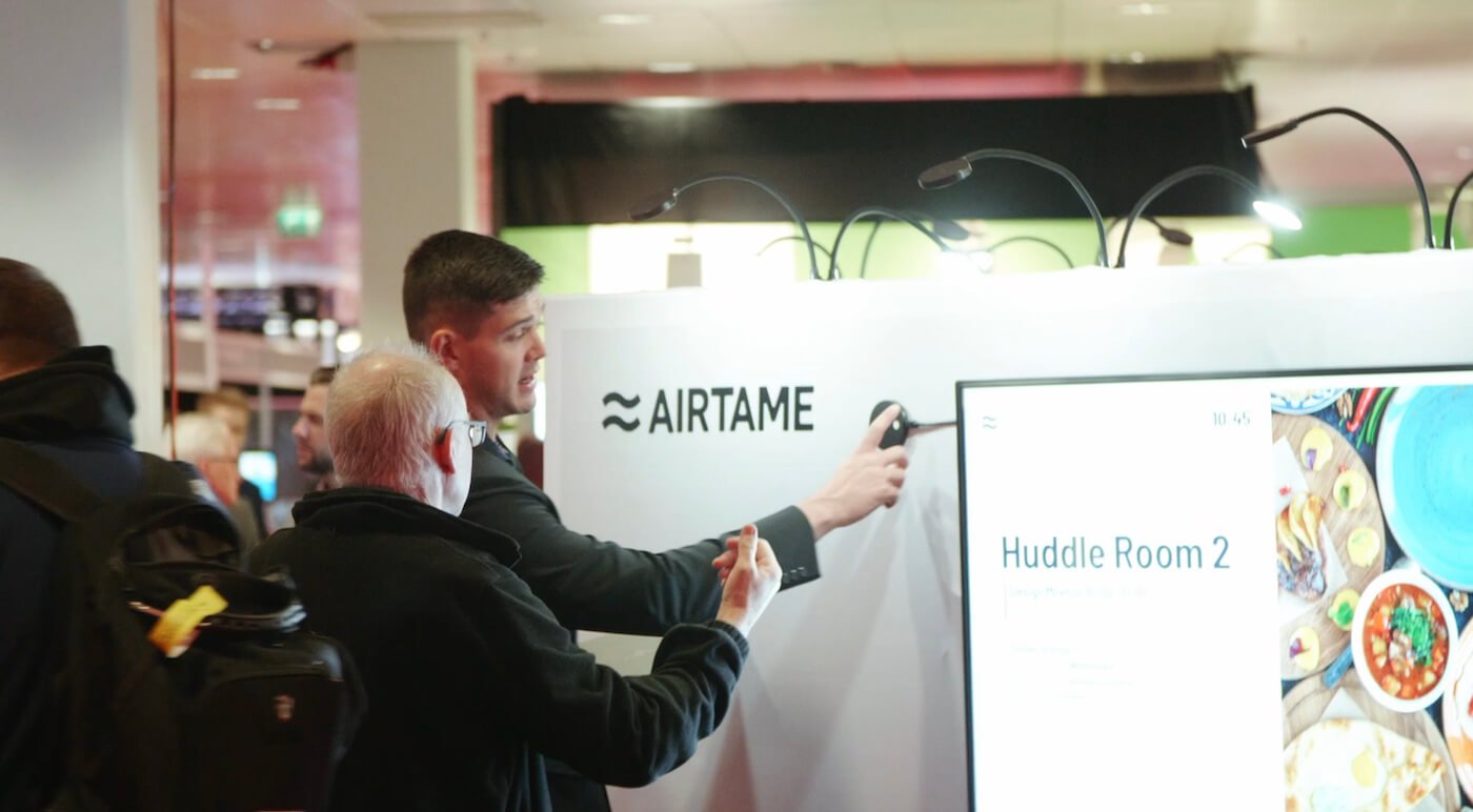 Airtame representative introducing the device to a potential customer 